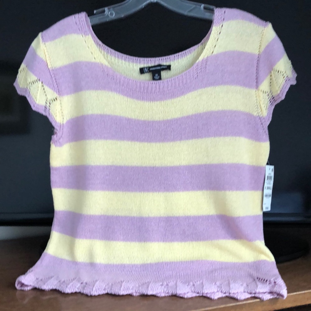 Beautiful, brand new women blouse by INC. Smoke free home. Excellent condition.